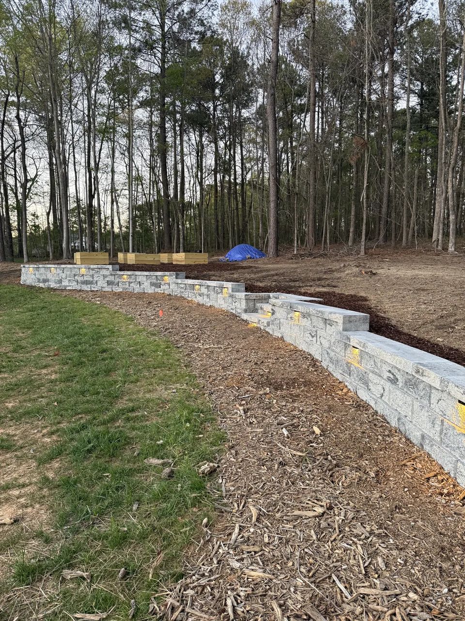 Install day: curved retaining wall before the lawn went in