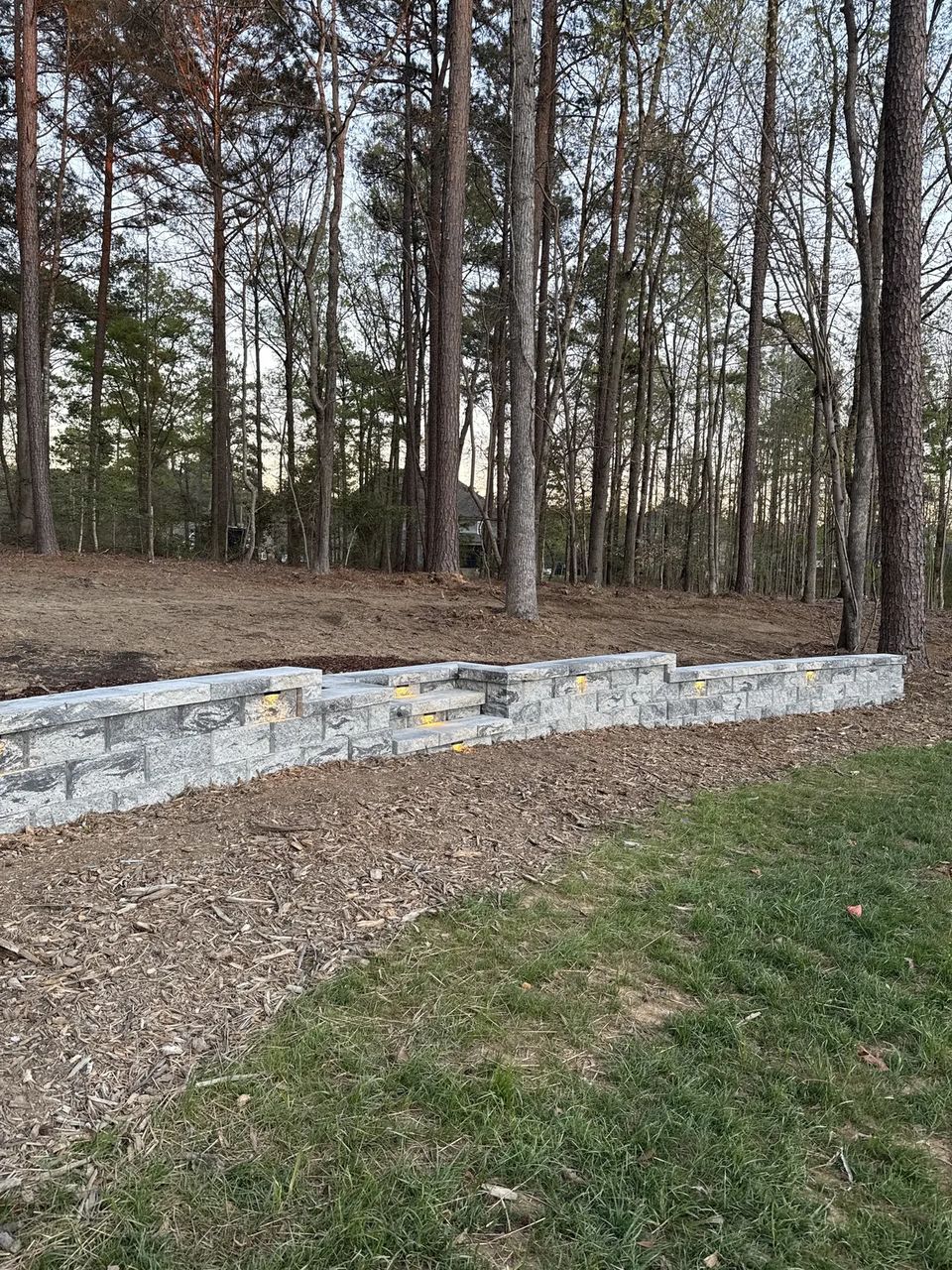 Drone view of the curved retaining wall and new lawn