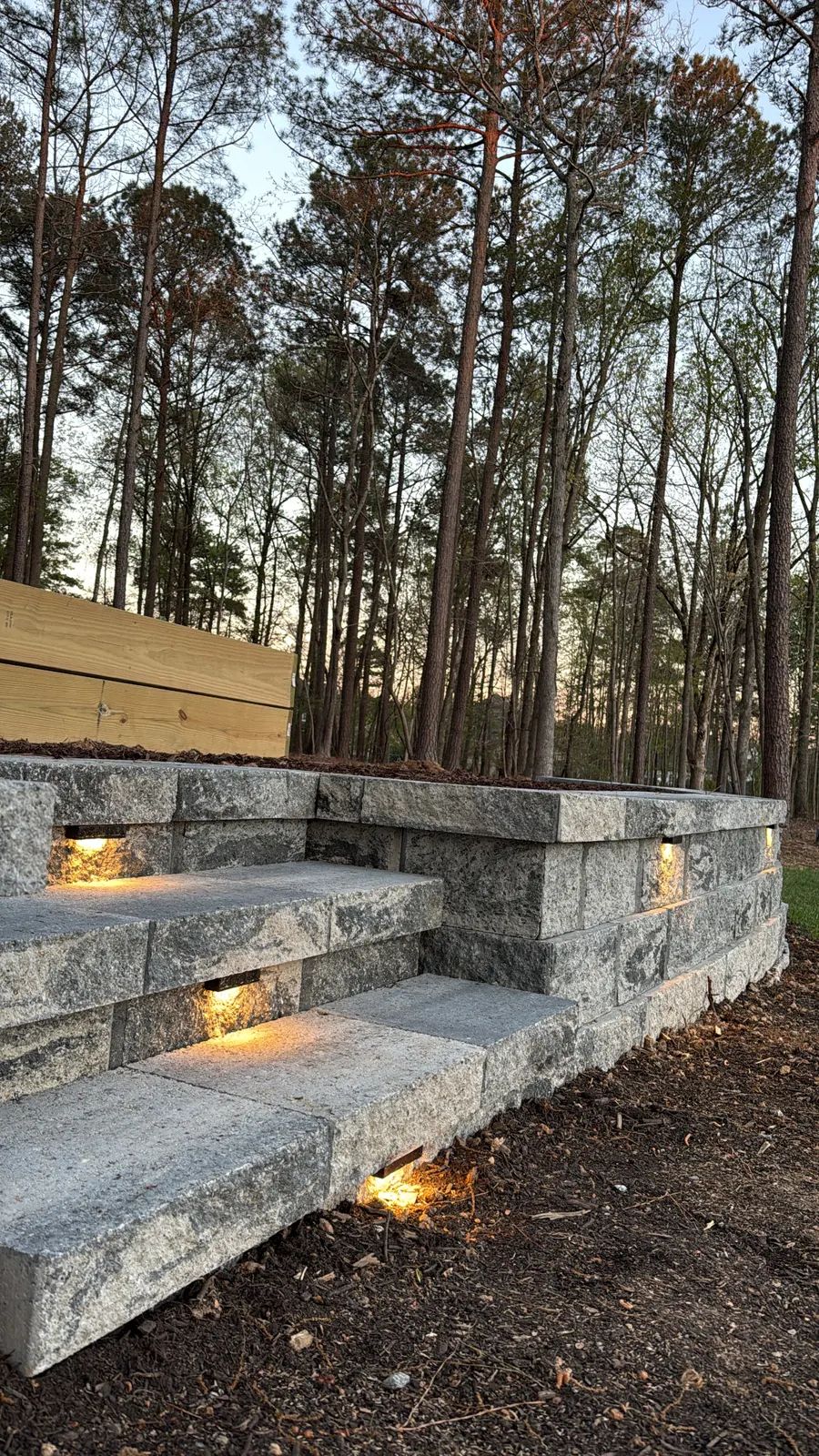 Step lights in the curved retaining wall