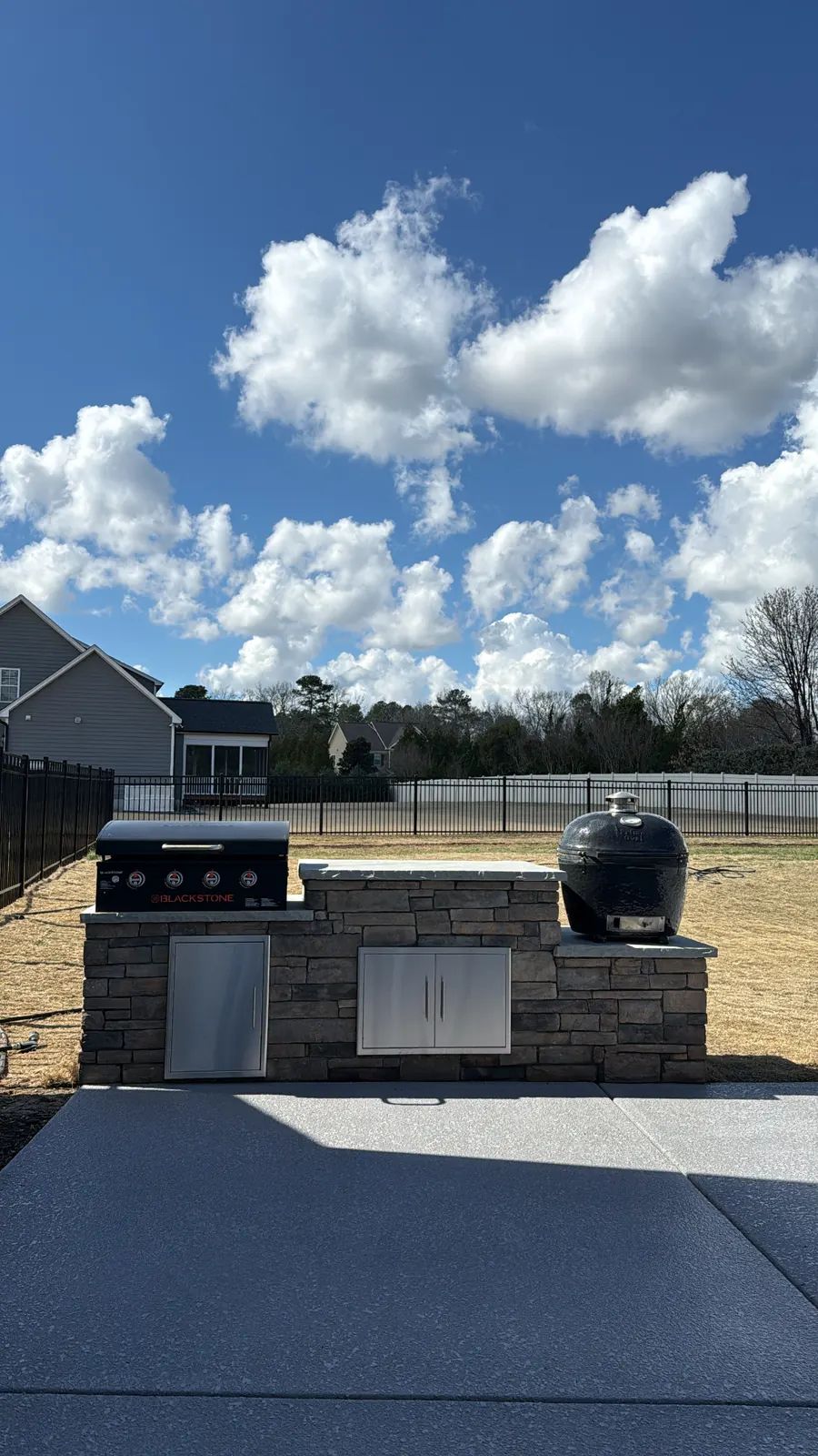 Grill island and patio with clouds overhead