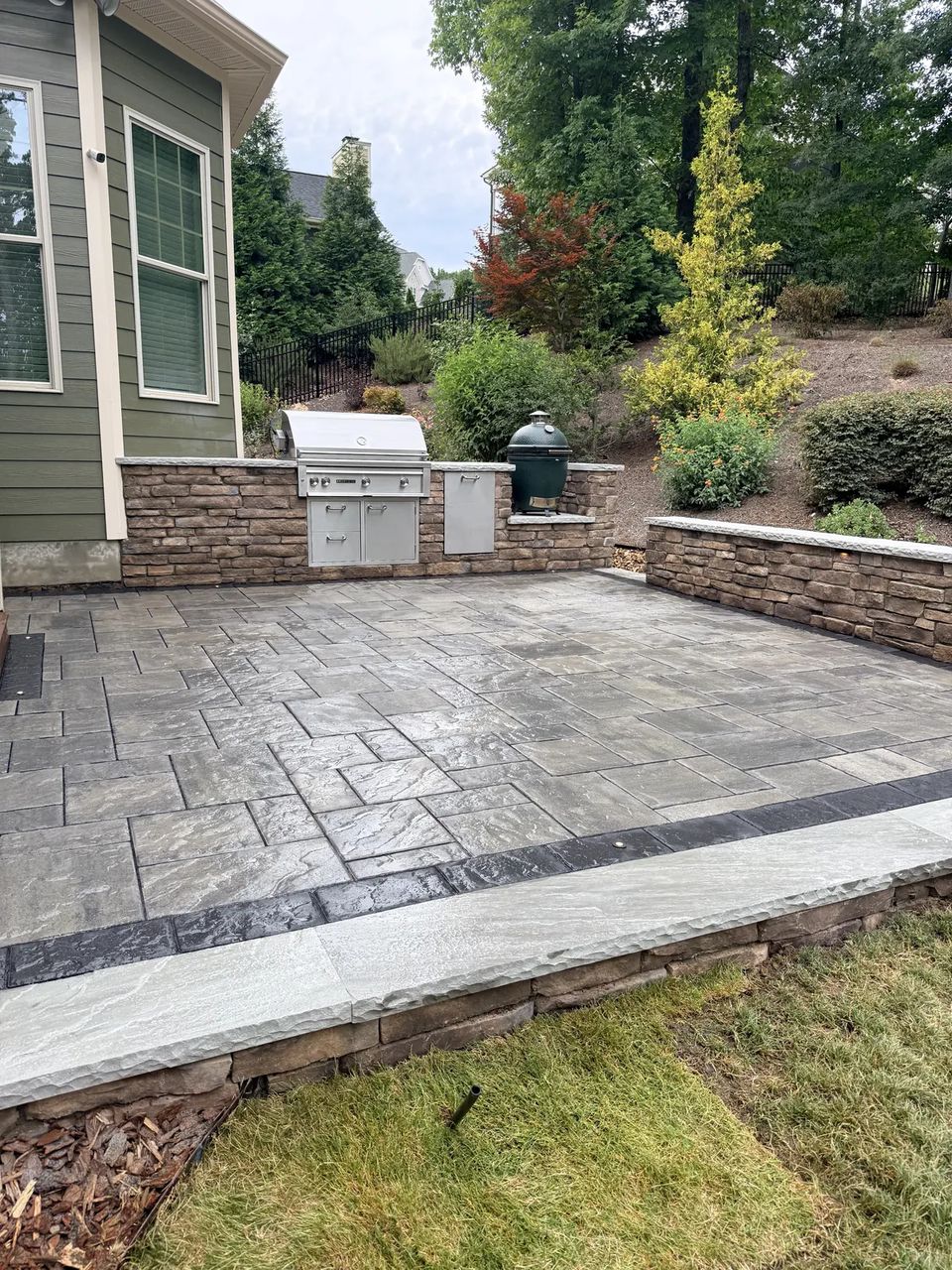 Patio border band and stone seat wall at the kitchen patio