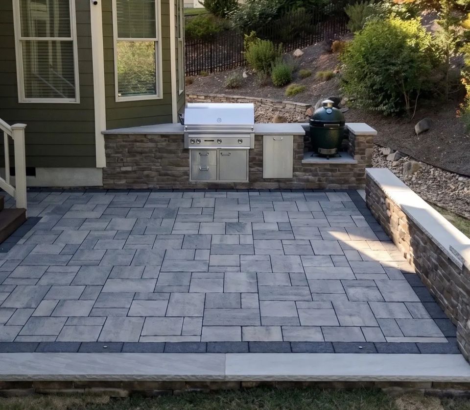 Straight on view of the kitchen patio with its border band and built in grill