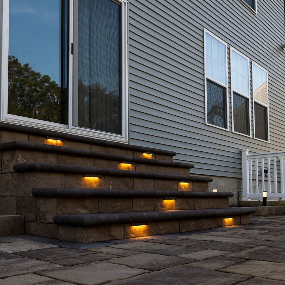 Close view of lit steps by the back door