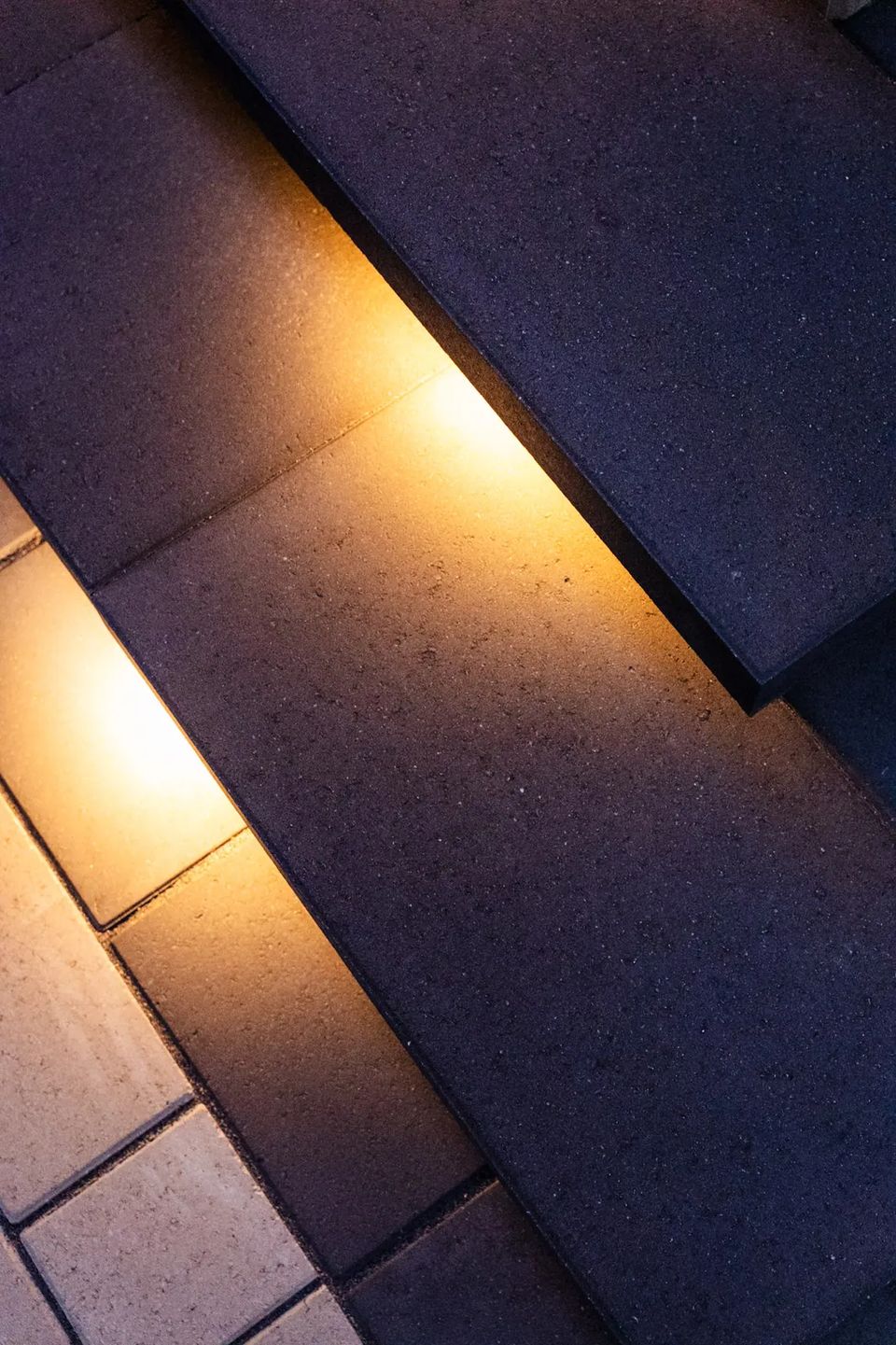 Detail of a lit stone tread edge