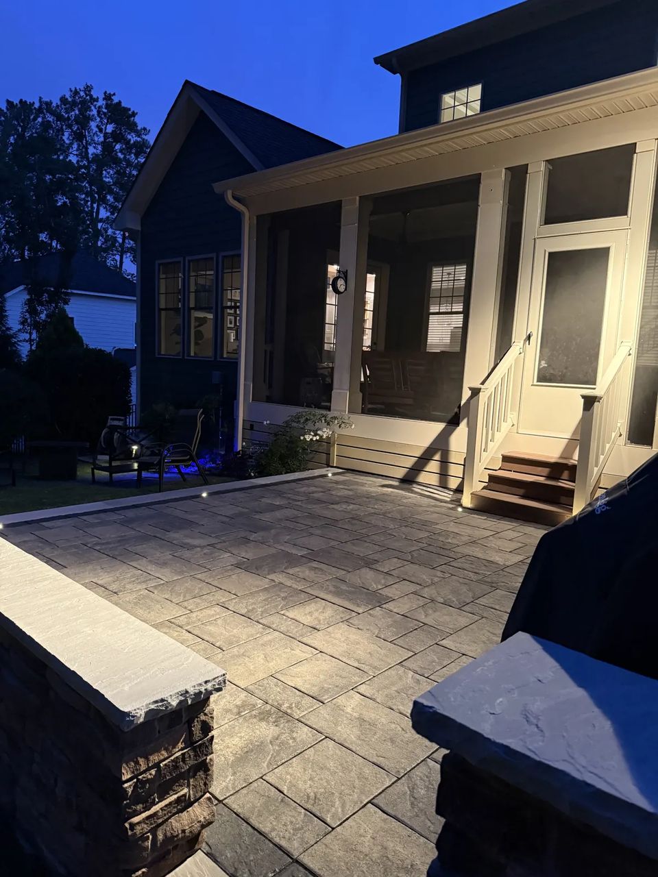 Pillar caps and screened porch at dusk