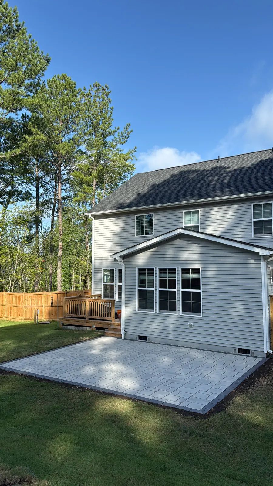 Wide view of the rear patio and the house