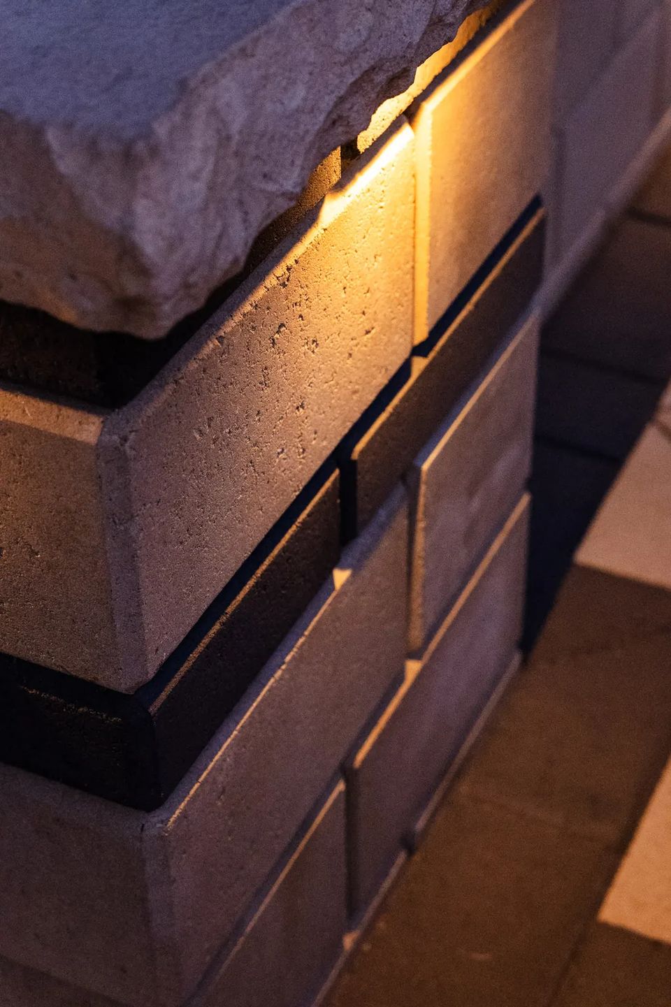 Wall cap and light detail at night