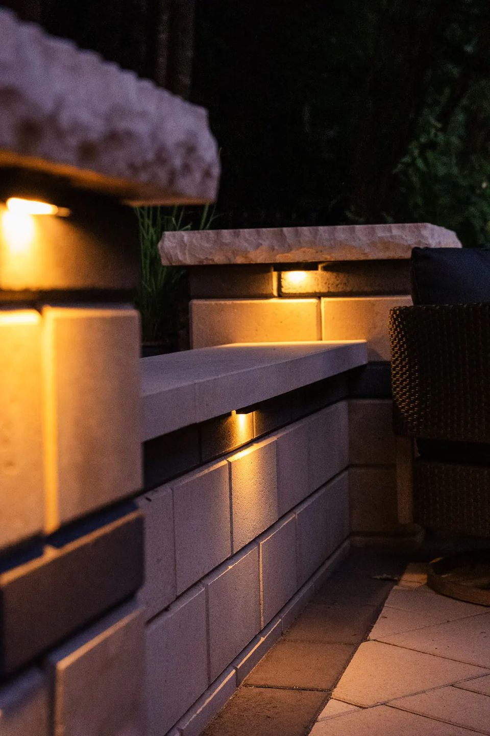 Seat wall pillar with a cap light at night