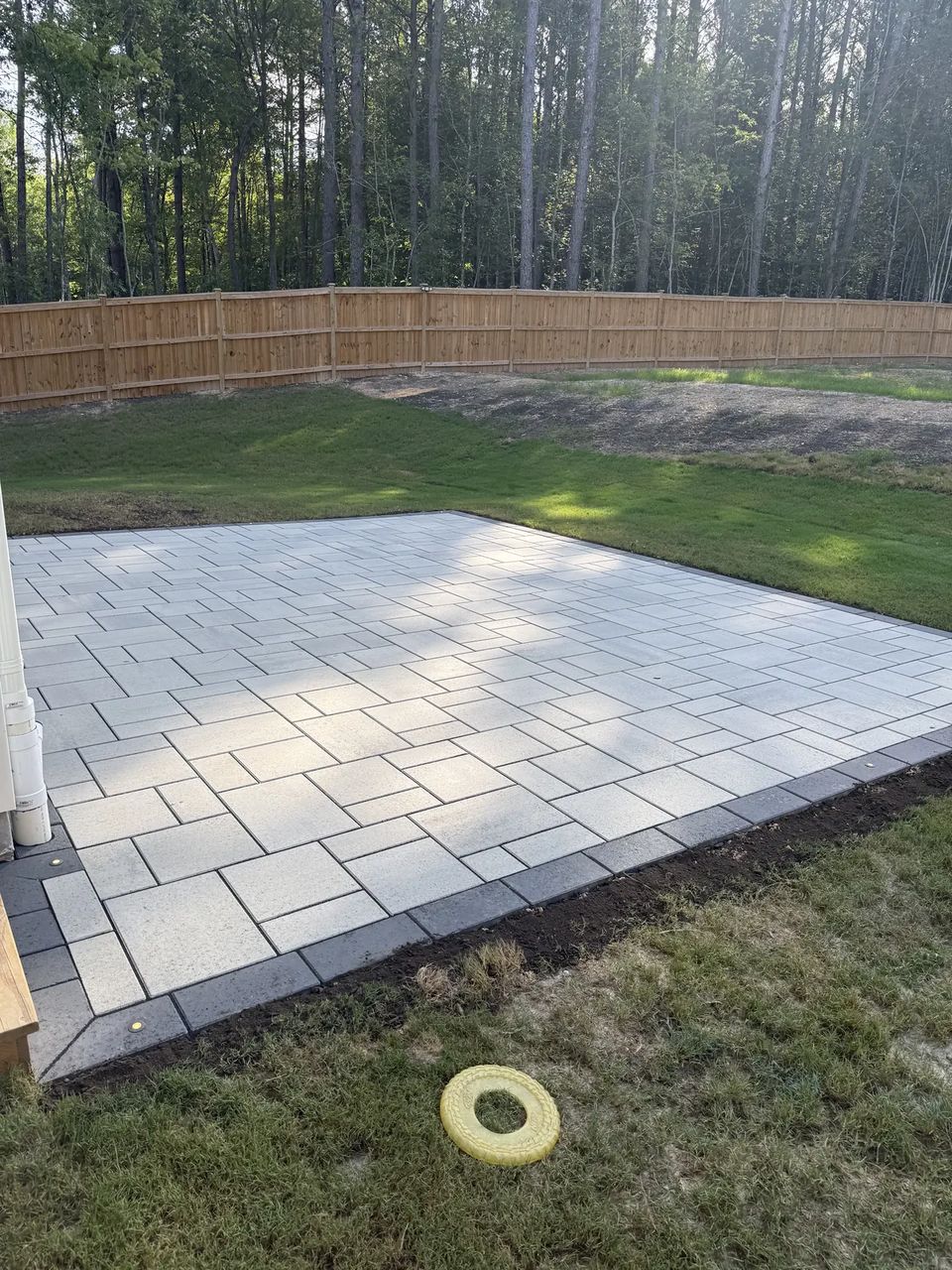 Slab patio meeting the lawn edge
