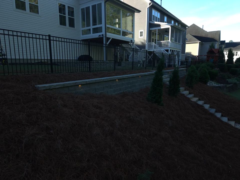 Planted slope and retaining wall at dusk
