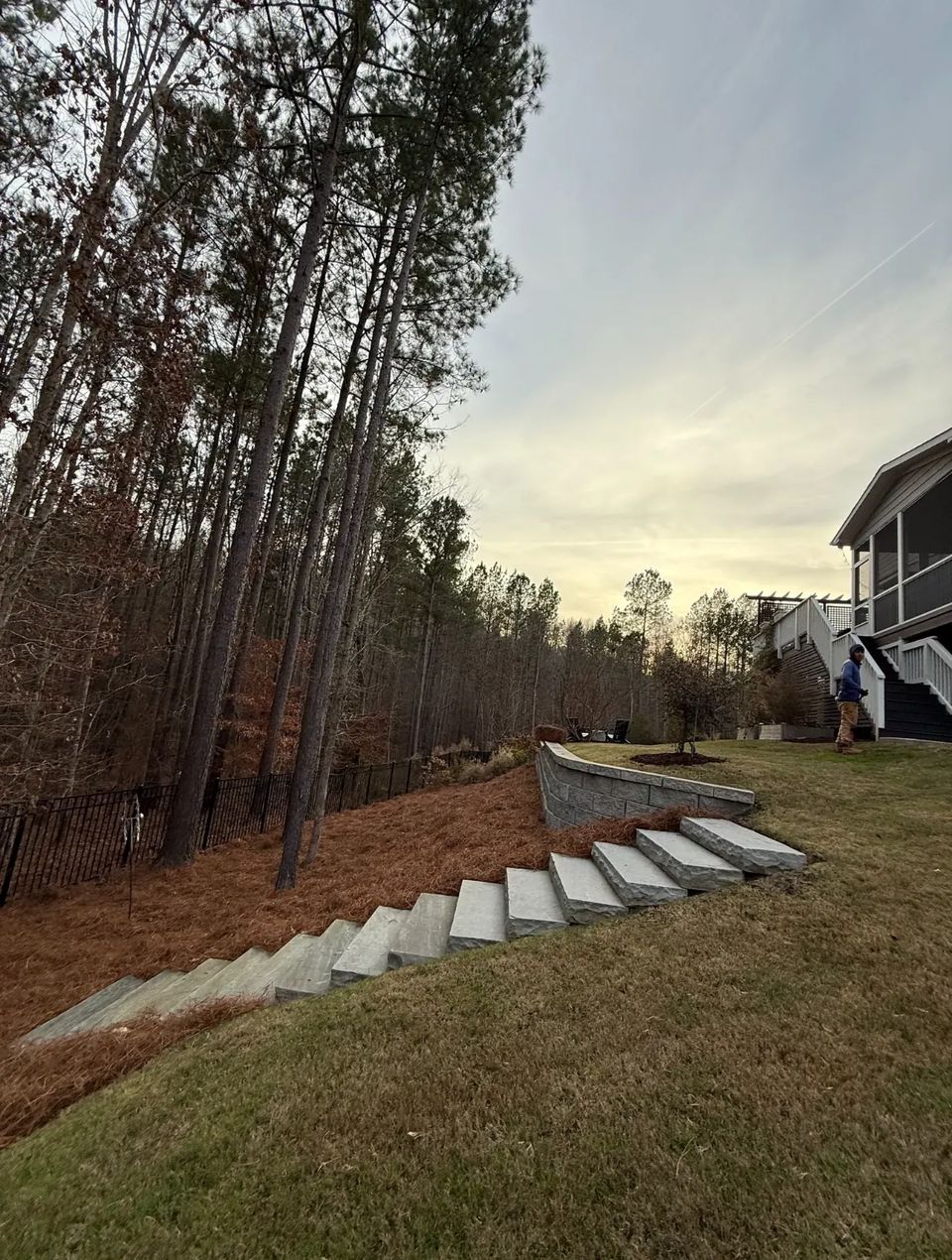 Stone steps running down a wooded slope